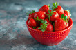 red bowl filled with ripe strawberries. fresh  strawberry fruits