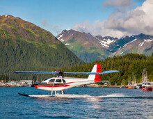 Seaplane Landing In The Harbor In Ketchikan, Alaska.
