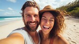 Fototapeta Do akwarium - Couple on summer tropical vacation taking selfie photo on the beach. Man and woman on Mexico caribbean travel
