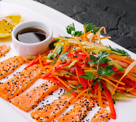 Wall Mural - Salmon Slices with Carrot and Pepper Salad and Soy Sauce - Asian Cuisine