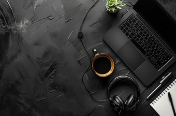 Wall Mural - laptop, headphones, cup, and notebook with dark background