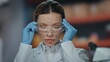 © stockbusters - Laboratory chemist wearing protective glasses for work in medical clinic closeup