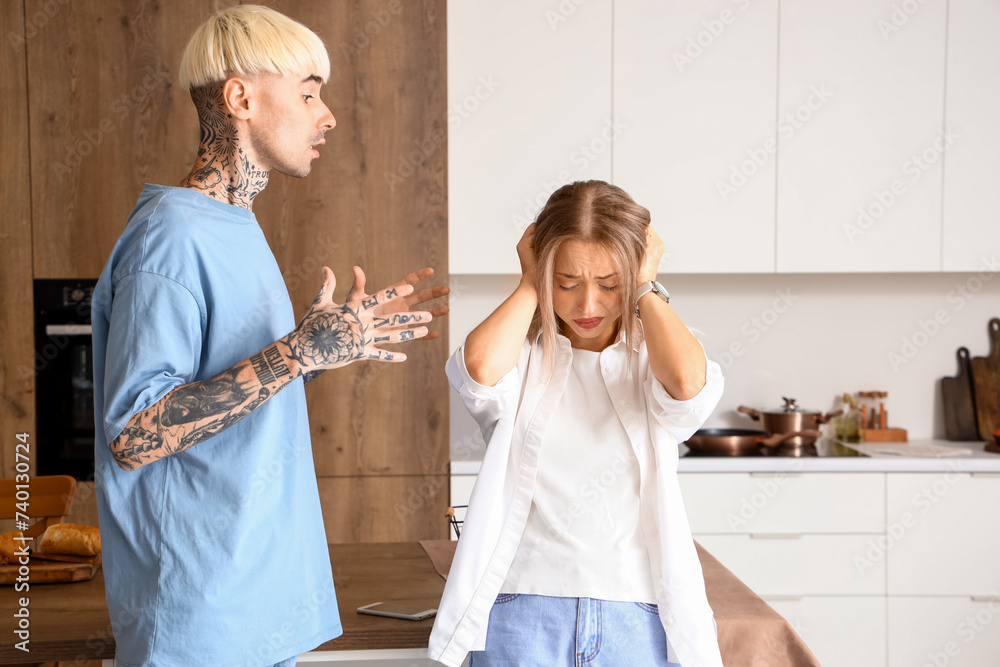 Young couple quarreling in kitchen