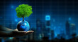 © Peachayatanomsup - Man hand holding Tree on Earth with Technology Economic. Tree growing on Earth and Night city background. Green computing, Green IT, csr, and IT ethics, and Saving Energy Concept.