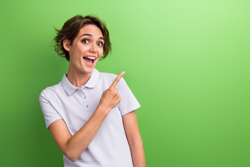 Sticker - Photo attractive young woman astonished recommend subscribe social media channel where posts promo codes isolated on green color background