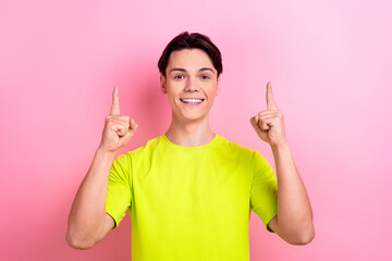 Sticker - Photo portrait of nice teen man point up empty space poster dressed stylish yellow clothes isolated on pink color background