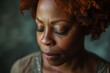© Davin - Close-up of a African woman with a serene expression and closed eyes, showing a moment of contemplation sad depressed despair upset and calm.