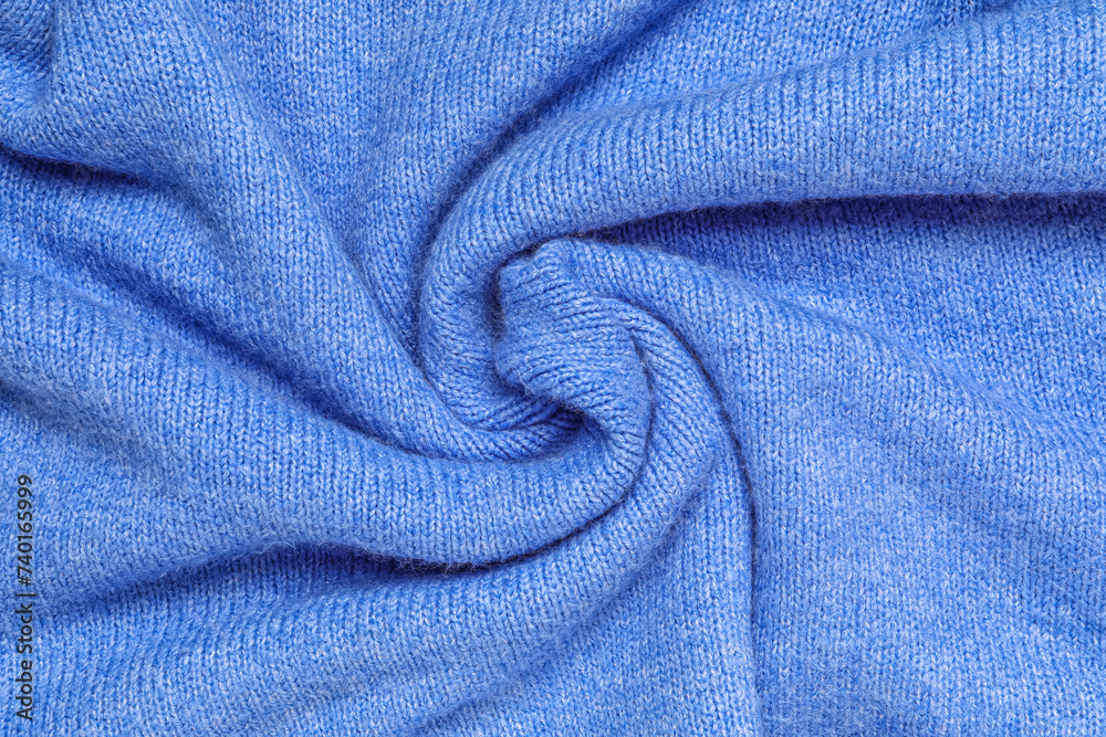 Texture of stylish knitted fabric with folds as background