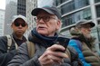 © Thaniya - Elderly man with a thoughtful expression holding a phone, city exploration, tech-savvy senior. Mature urban explorer in winter attire using a smartphone, curious gaze, modern city background.