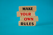 Make your own rules symbol. Concept red words Make your own rules on brick blocks. Beautiful blue background. Business motivational make your own rules concept. Copy space