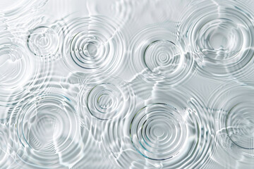 Poster - Water droplets glistens with clarity, reflecting the surrounding light. The intricate patterns and shapes formed by the droplets add a unique texture to the surface.