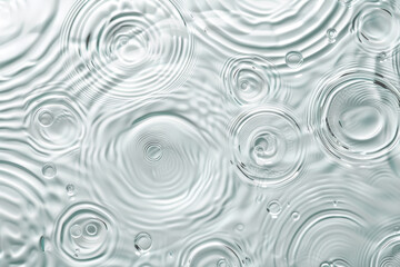 Fototapete - water droplets on a surface, capturing their intricate formations. The droplets glisten in the light, creating a captivating visual effect