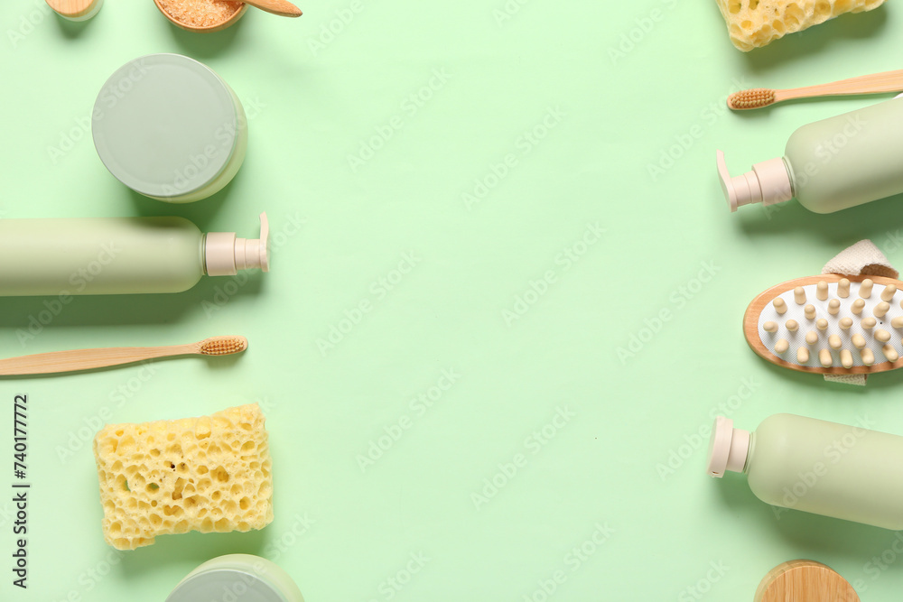 Frame made of bath supplies on green background