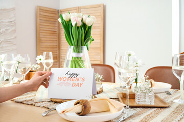 Sticker - Female hand with stylish table setting and greeting card for International Women's Day celebration