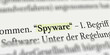 Das Wort Spyware im Buch mit Textmarker markiert
