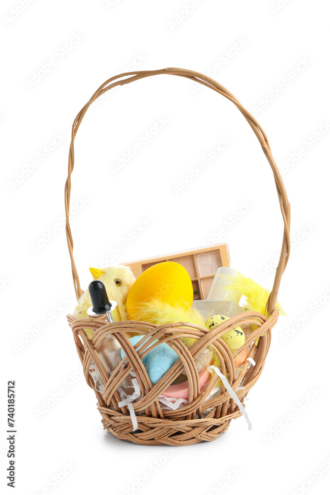Wicker basket with decorative cosmetics, Easter eggs and baby chicken isolated on white background