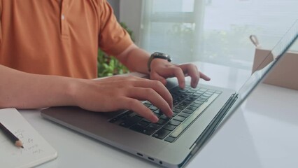 Cropped shot of unrecognizable male programmer coding on laptop while working at office