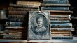 A vintage photograph of a young girl is propped against stacked antique books, creating a sense of history and nostalgia