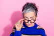 Portrait of strict funny woman wear striped pullover fingers touch glasses suspiciously look at you isolated on pink color background