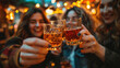 © Soeren - Group of friends toasting with glasses of beer in bar, close up