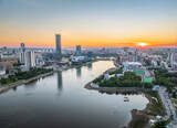 Fototapeta  - Yekaterinburg city and pond aerial panoramic view at summer sunset.
