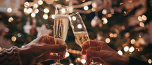 Celebratory champagne toast with friends, glowing against a festive backdrop of twinkling lights.