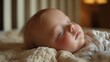 © OKAN - Peaceful sleeping baby on soft blanket with warm lighting