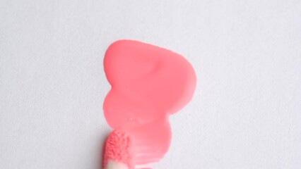 Poster - Pink lipstick, lip gloss texture. Cosmetic product in trendy peach fuzz color smear smudge swatch sample. Macro