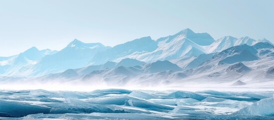  A stunning view of a glistening mountain range covered in snow and ice, set against the frozen Lake Baikal.
