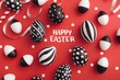 HAPPY EASTER black and white easter eggs are arranged on red background with stripes Generative AI