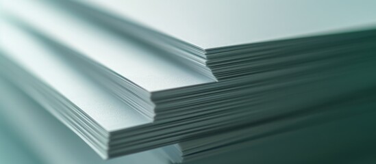 Poster - A close up of a stack of paper sheets on top of each other, made of composite material. The stack is placed on a rectangular glass table with a hardwood base