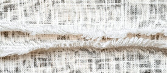 Poster - This close-up photo showcases the intricate texture of a piece of white linen fabric. The light-colored fibers create a soft and delicate pattern, perfect for textile enthusiasts and designers.