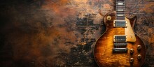 A Vintage Wooden Guitar Is Resting On Top Of A Wooden Table, Showcasing Its Beautiful Craftsmanship And Warm Tones. The Guitars Intricate Details Are Visible Against The Distressed Leather Background.