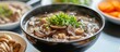 A cozy bowl of mushroom and green onion soup sitting on a table ready to be enjoyed. This delicious dish combines fresh ingredients and warm flavors
