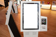 Blank white mockup background texture template of a kiosk machine with a touch screen and an attached POS machine. Copy space on a smart interactive machine service device for customer self-checkout.