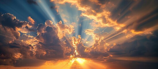 Wall Mural - A mesmerizing sunbeam casting its rays in the sky amongst fluffy clouds