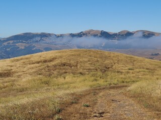 Poster - The Marine layer clouds can be seen in the distance across the East Bay hills near San Ramon, California