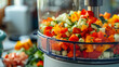 Vibrant and colorful diced vegetables being prepared in the food processor for a fresh and healthy salad.