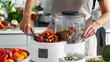 The food processors wide feed tube capable of fitting whole vegetables and fruits for effortless slicing.