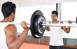 Man, barbell and weightlifting at mirror for training exercise as bodybuilder for workout strength, wellness or routine. Male person, equipment and reflection in Miami for healthy, biceps or sport