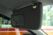 © fadfebrian - Car sun visor in the down position. Car interior.