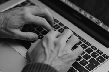 Poster - A close-up shot of a person typing on a laptop keyboard, focusing on their hands and the keyboard, Close-up view of hands typing on a laptop keyboard, AI Generated