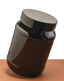 Fototapeta Tulipany - Czarny pojemnik plastikowy, opakowanie na leki, tabletki lub odrzywkę.