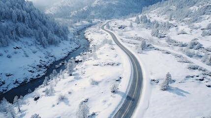 Aufkleber - Aerial view of a snow covered mountain road, perfect for travel and winter themes