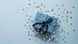 Dark blue gift box with gold satin ribbon on dark background. Top view of birthday gift with copy space for holiday or Christmas present. Ai generative.