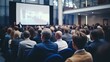 © Anton Gvozdikov - Attentive audience at a business conference listening to a speaker presenting in a contemporary setting.