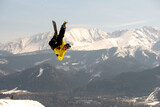 Fototapeta  - Skier jumping in the mountains