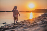 Fototapeta  - child on the beach