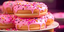 Close Up Of Vanilla Cake Donuts With Pink Icing And Sprinkles. 4K Video