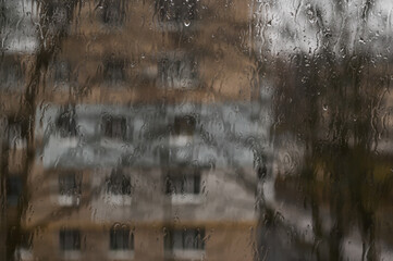 Wall Mural - the background of drops on the window glass during the rain.